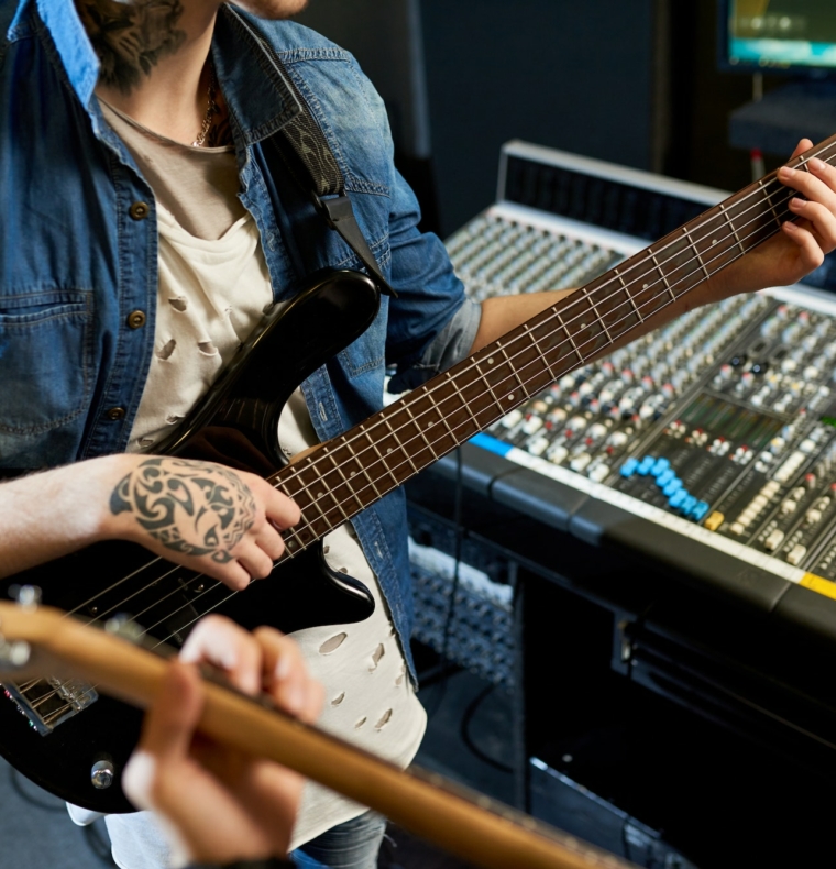 Guitarists playing music for recording