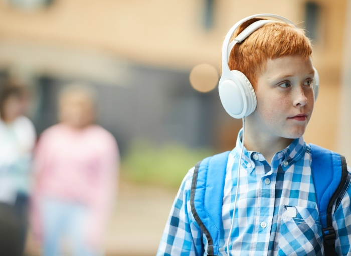 Schoolboy listening to music