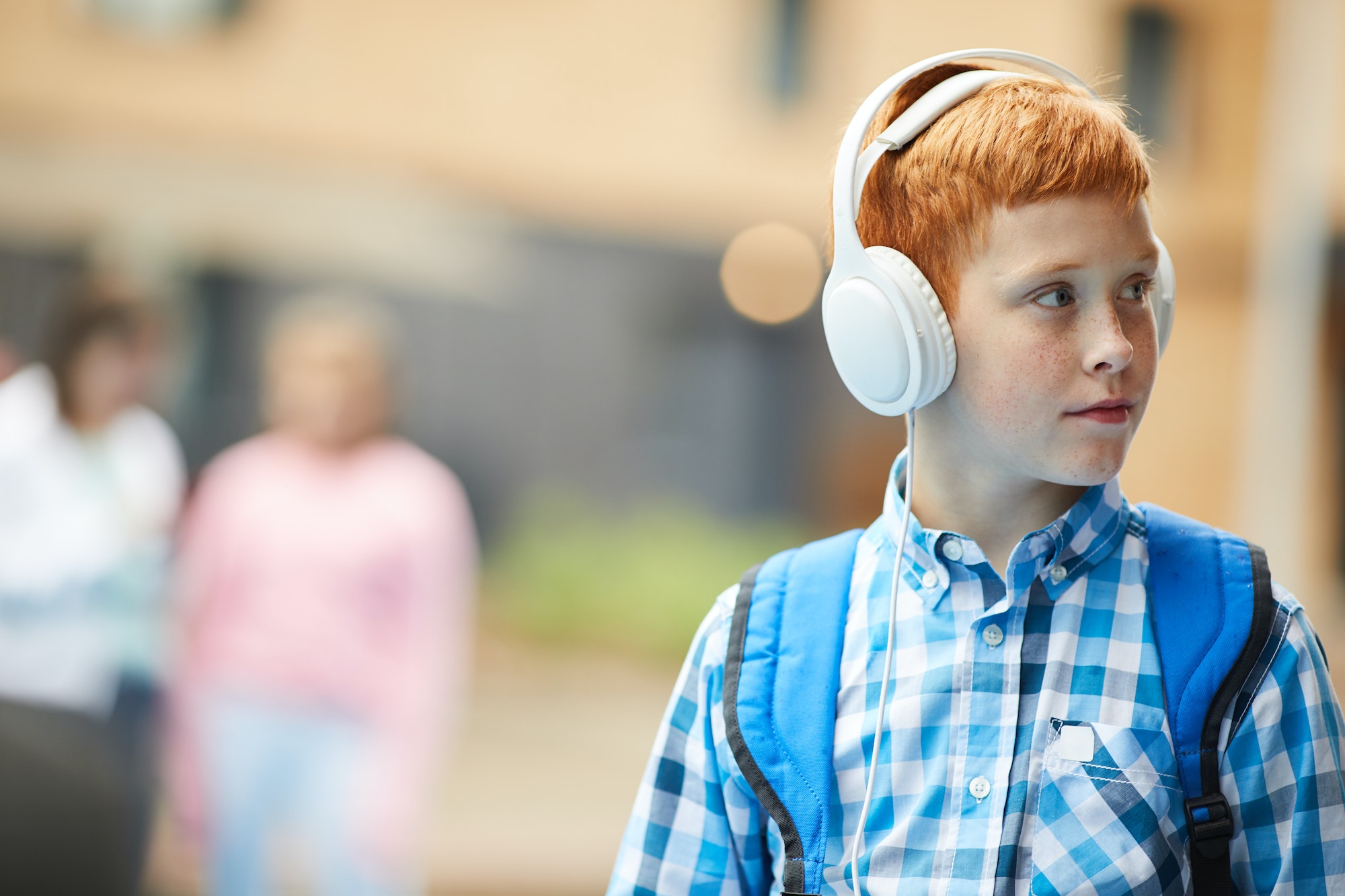 Schoolboy listening to music
