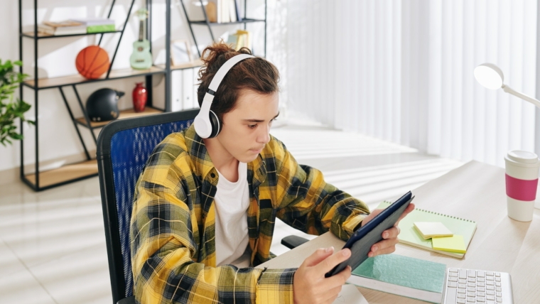 Teenager watching music video