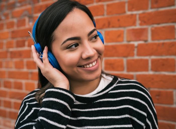 Woman listening to music with headphones