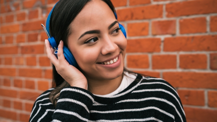 Woman listening to music with headphones
