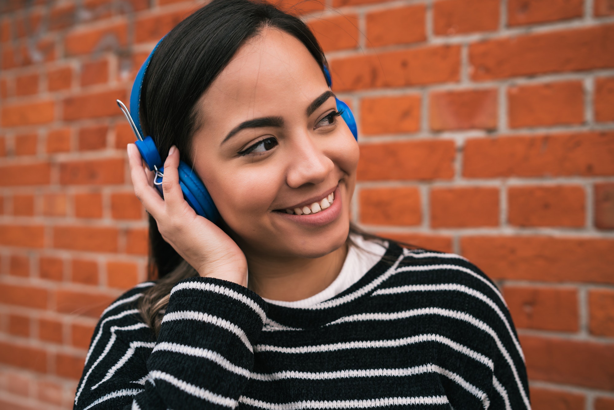 Woman listening to music with headphones